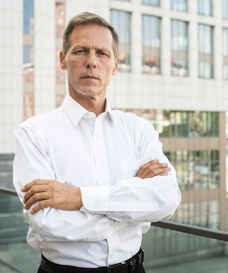 businessman looking camera with arms crossed